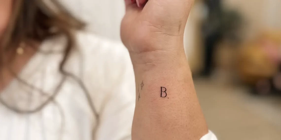 fine line flower tattoo